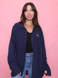 Model wearing a vintage navy Berghaus full zip Polartec fleece jacket with logo