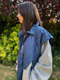 Stay warm in throwback style with this Vintage Grey and Blue Fleece Jacket featuring a quilted overlay for extra texture and durability. Combining classic fleece softness with quilted panels, this zip-up jacket has a functional, outdoorsy vibe with timeless retro appeal.

