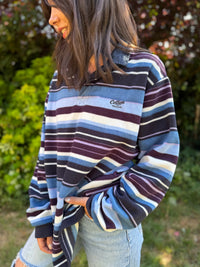 Cotton Traders Vintage Striped Fleece. Retro rugby-style 1/4 button pullover with bold stripes and cozy fleece texture – perfect for casual layering.