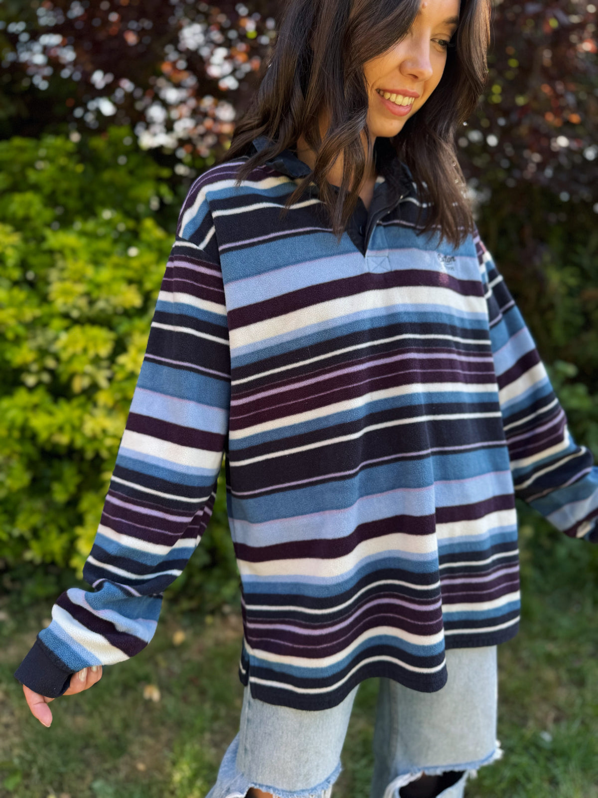 Retro fleece pullover by Cotton Traders with bold stripes and button-up collar. Cozy rugby style with vintage flair.
