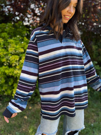 Retro fleece pullover by Cotton Traders with bold stripes and button-up collar. Cozy rugby style with vintage flair.