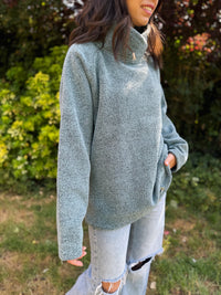 Regatta fleece pullover with high funnel neck in heather green. Cozy winter style for layering, hiking, or casual wear.