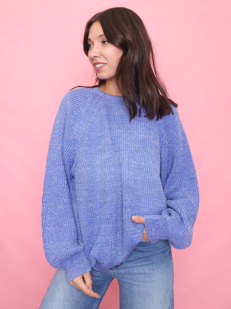 Model wearing a vintage lilac blue knit jumper with a relaxed oversized fit


