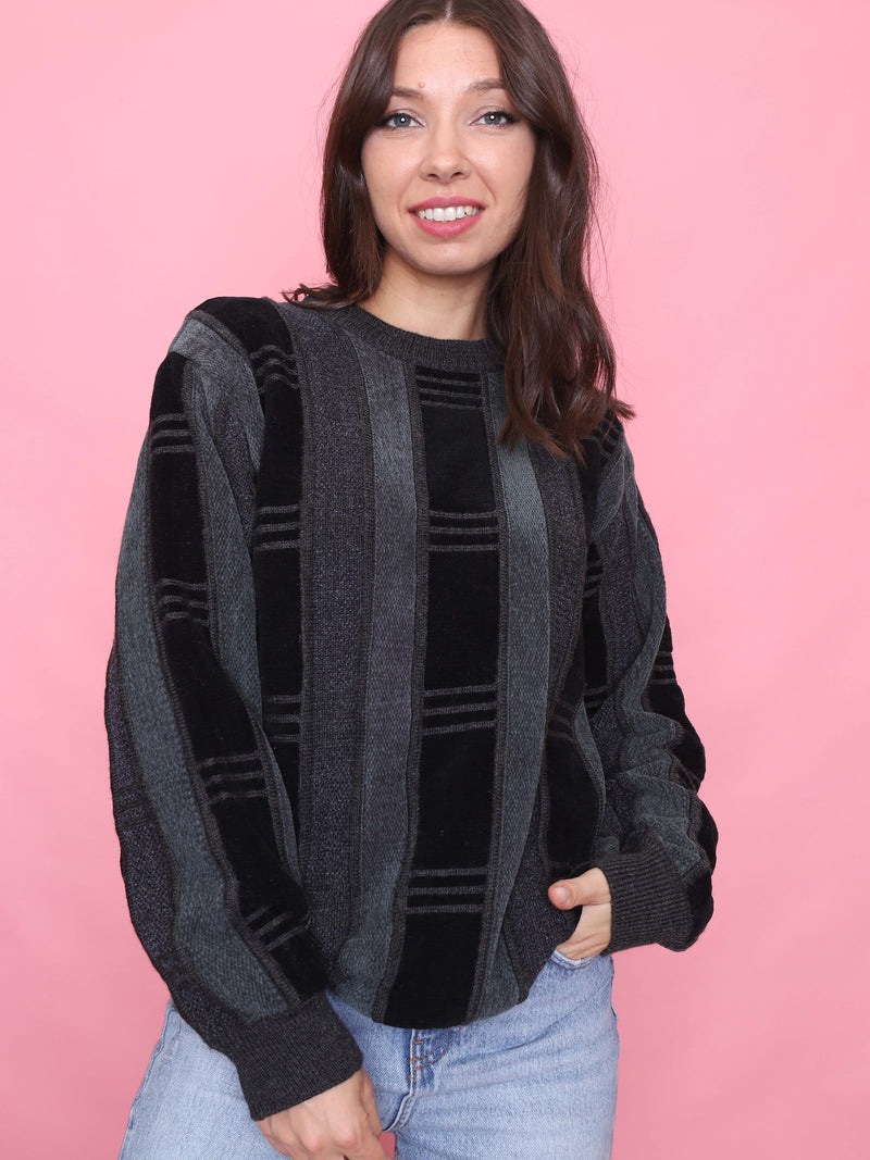 Vintage 90s striped knit jumper in black and charcoal grey, model wearing front view.