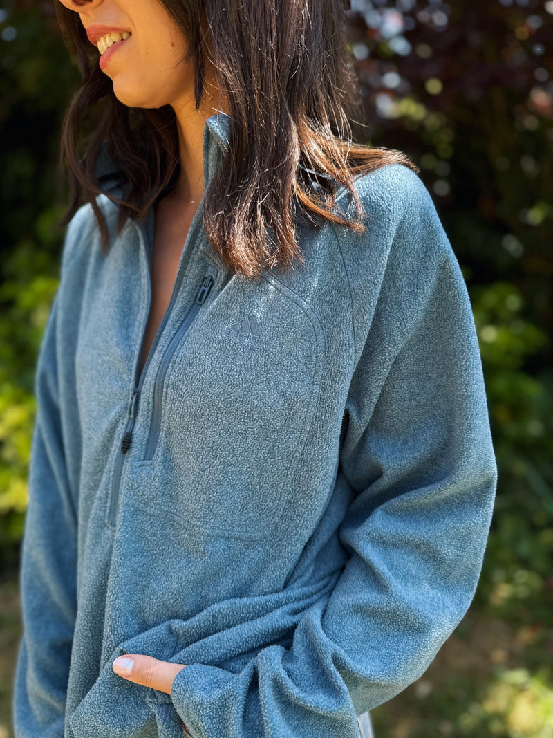 Model wearing vintage Adidas dusty blue 1/4 zip fleece pullover with chest pocket