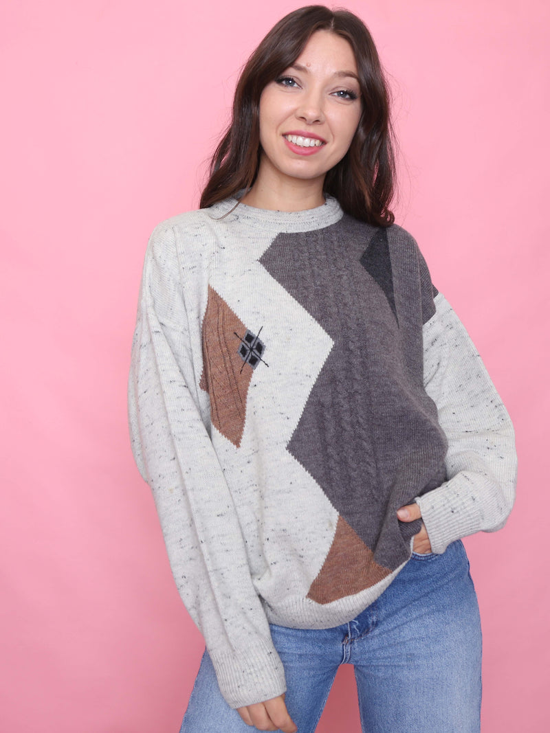 Model wearing vintage speckled oatmeal jumper with brown and charcoal argyle pattern, cosy autumn knit

