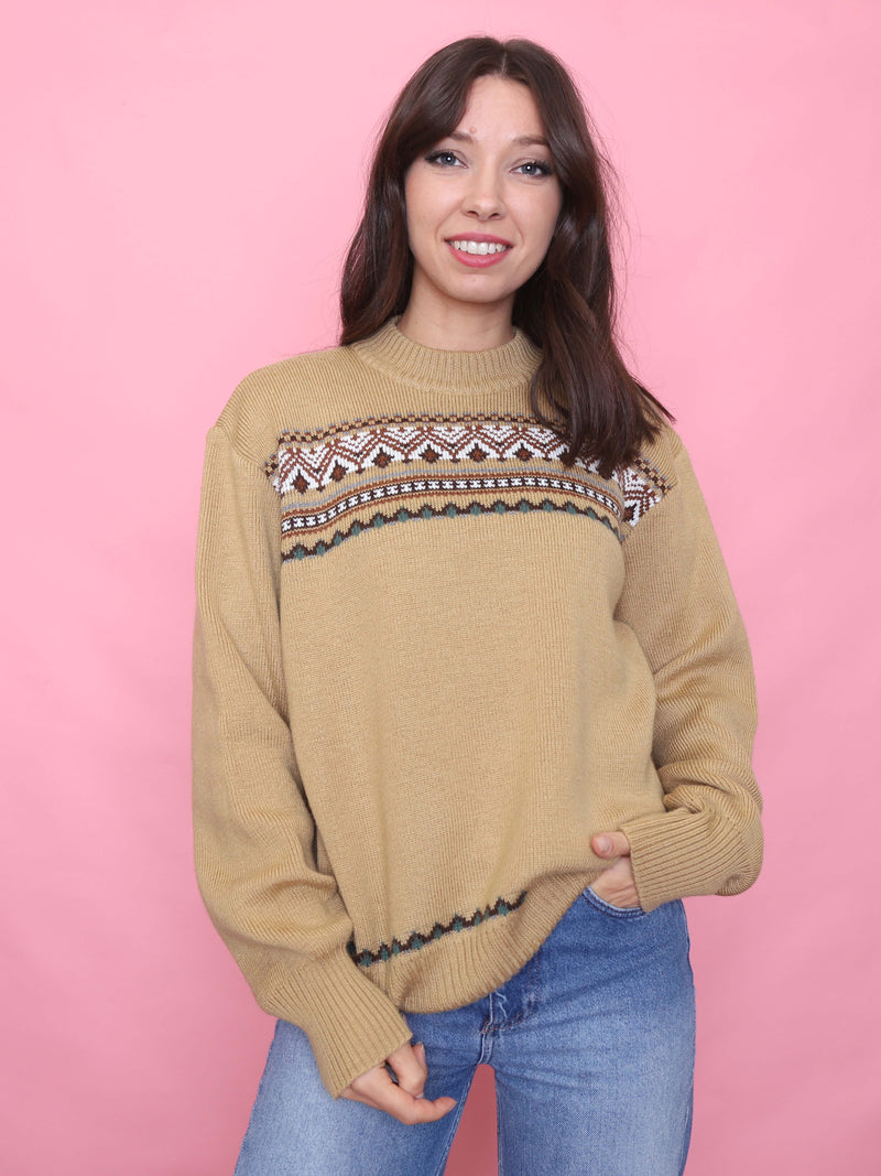 Model wearing a beige vintage knit jumper with Nordic-inspired pattern on chest and hem, autumn cosy aesthetic