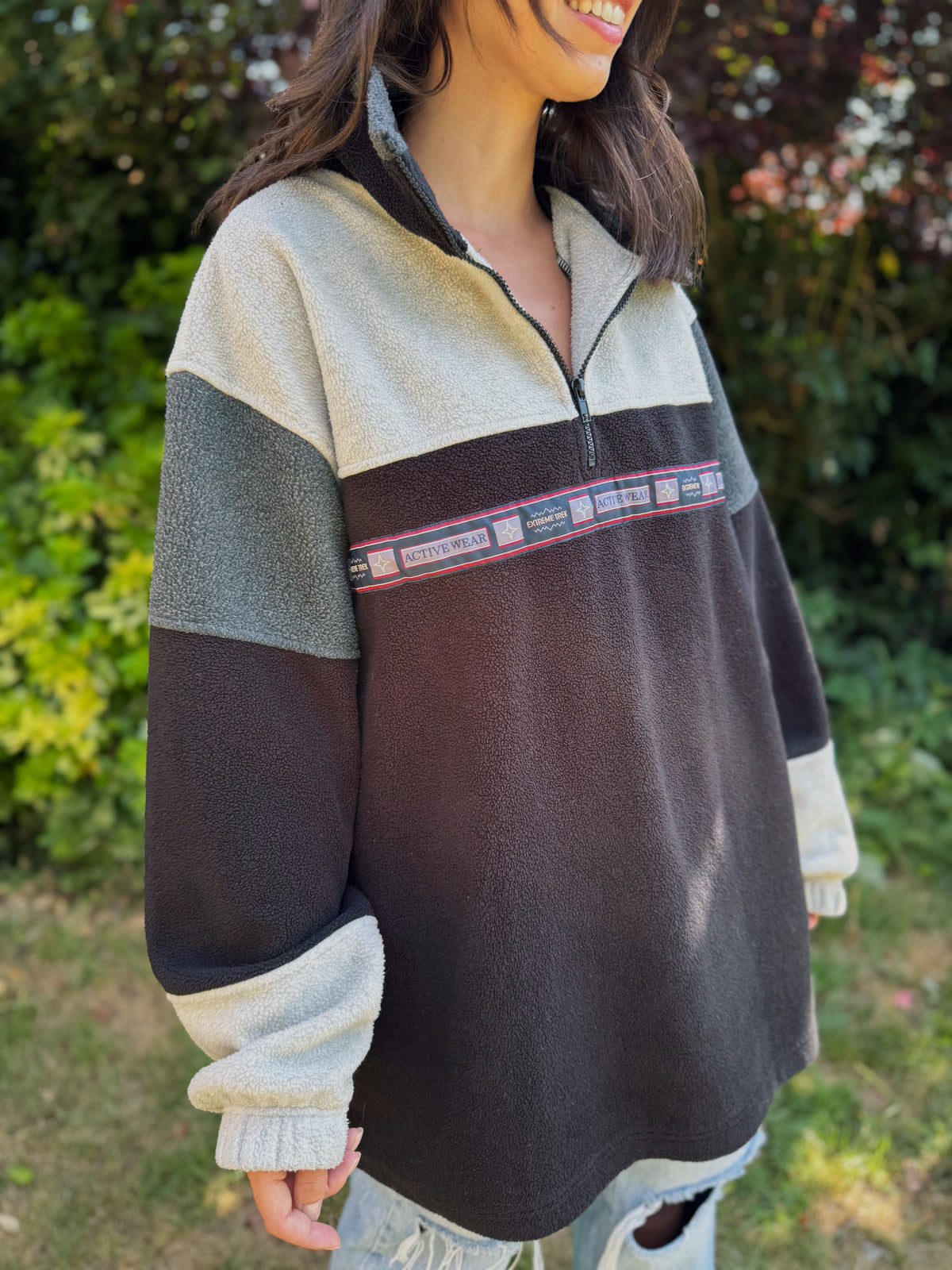 Vintage black and grey 1/4 zip fleece pullover with retro activewear tape design