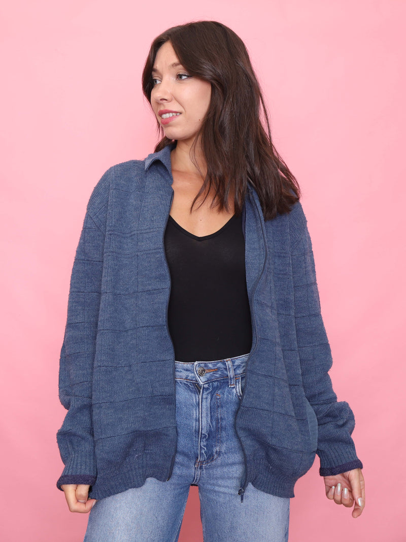 Model wearing a vintage blue zip-up cardigan jacket with relaxed fit

