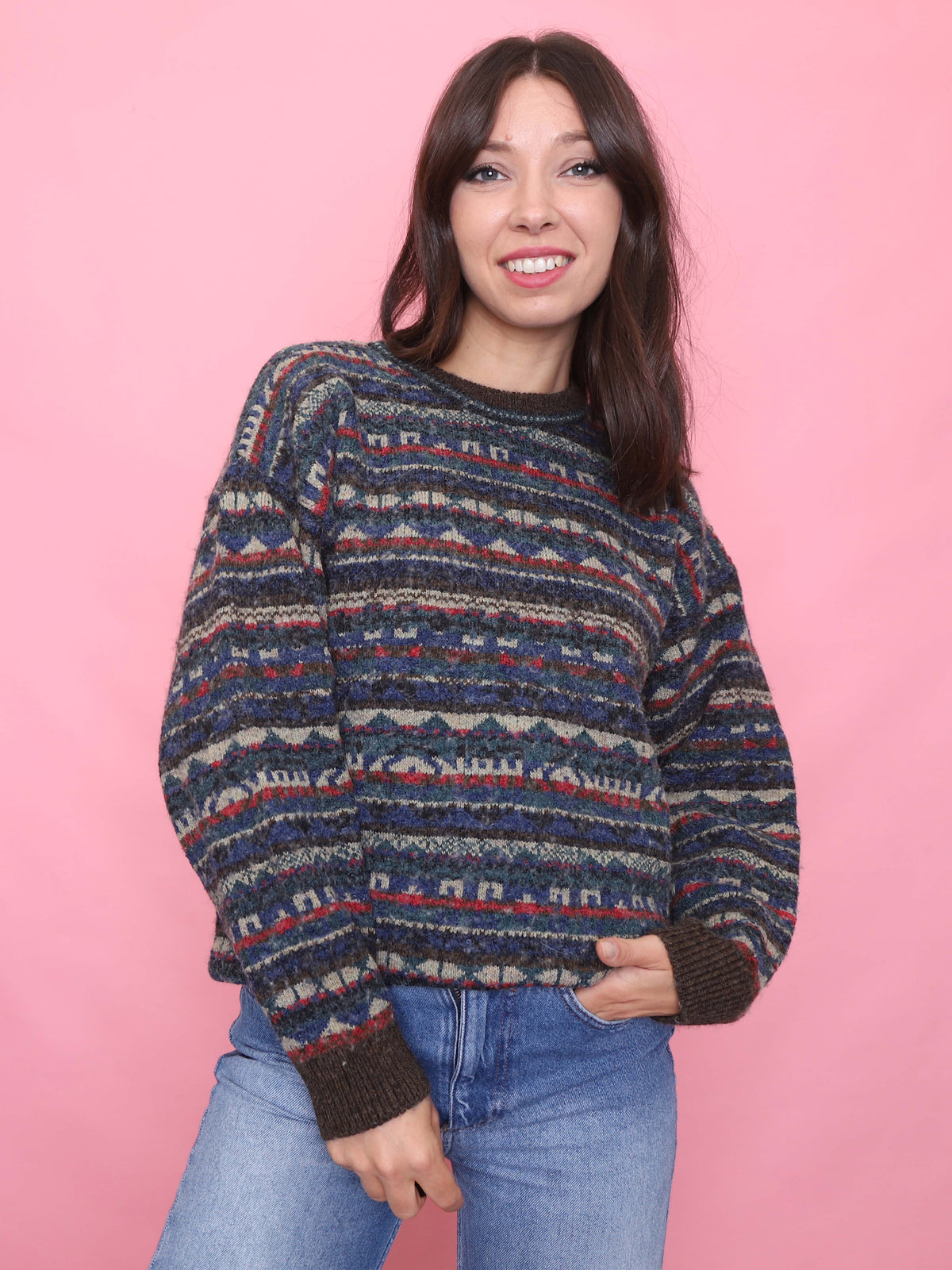 Woman wearing a vintage Fair Isle wool jumper in earthy tones, styled for autumn

