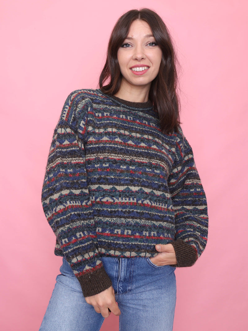 Woman wearing a vintage Fair Isle wool jumper in earthy tones, styled for autumn

