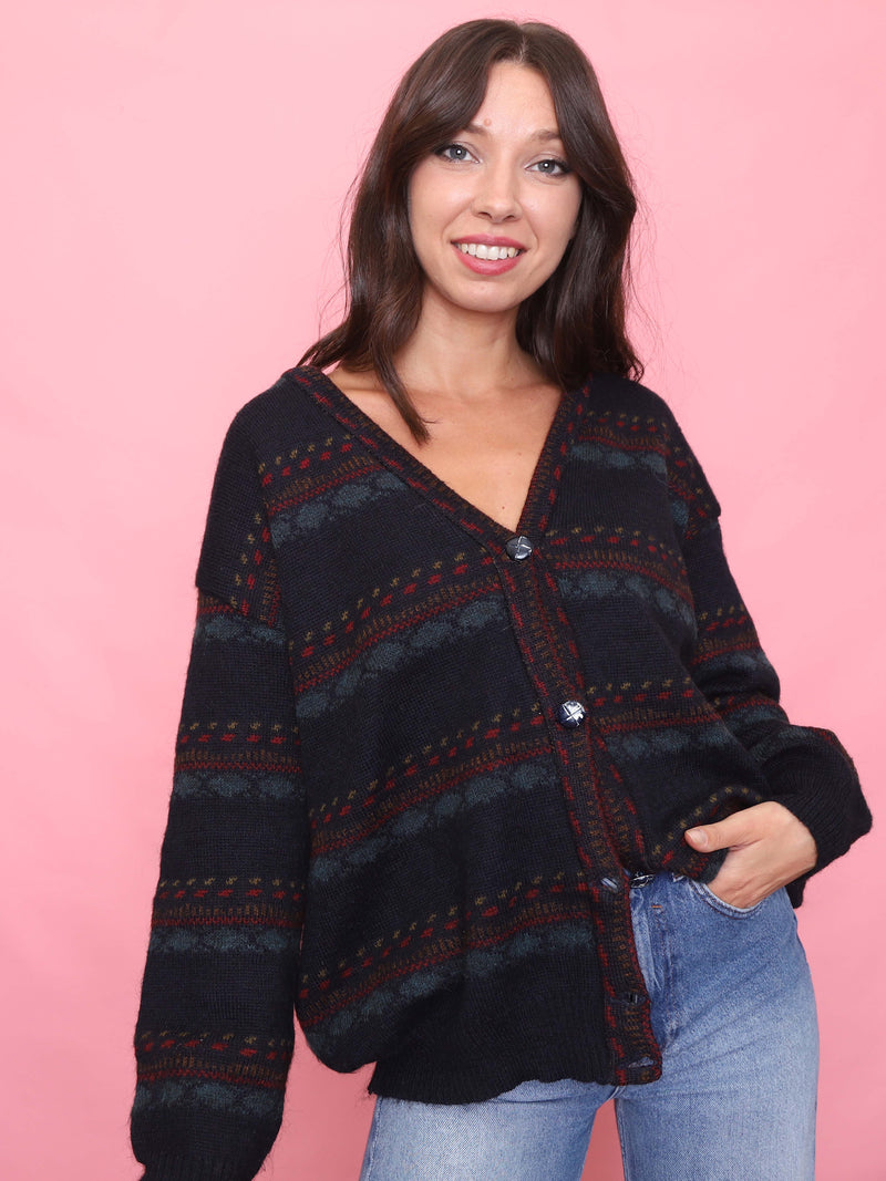Model wearing a vintage lambswool cardigan with red and green stripe pattern

