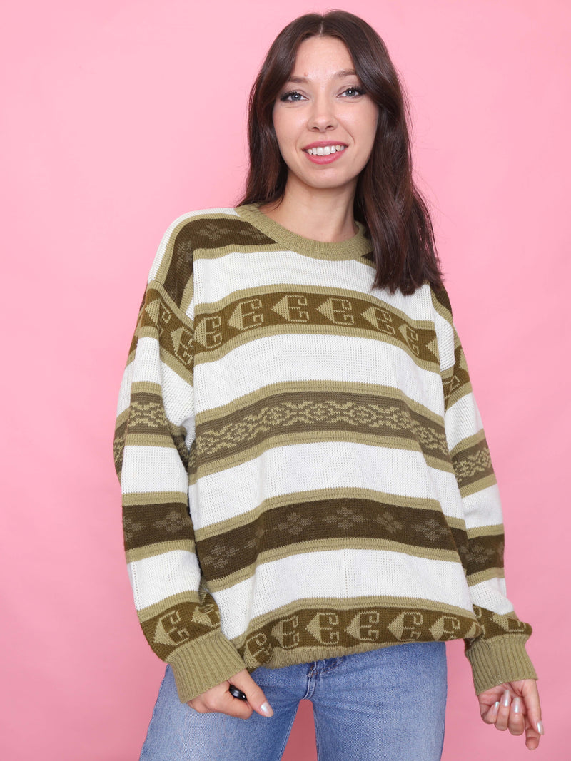 Woman wearing a vintage olive and cream striped knit jumper with earthy geometric pattern

