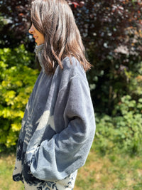 vintage polar fleece jacket featuring a forest bear scene. The ultimate cosy zip-up layer for winter and autumn adventures.